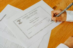 close up shot of a person signing a document