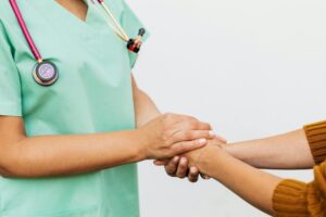 a doctor and patient doing handshake